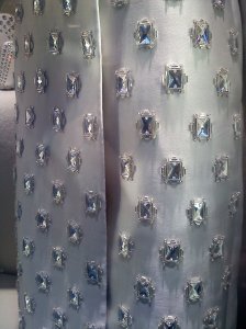 This bejeweled coat is in the window at Prada